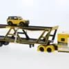 International Autotransporter, gelb/schwarz, 1:64, Maisto